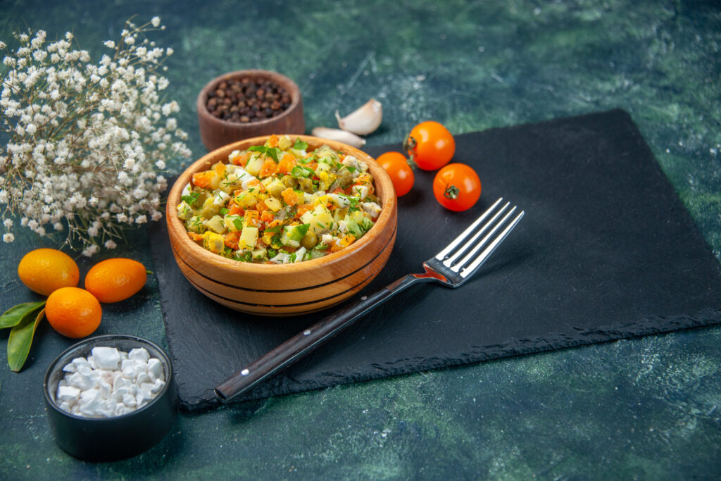 Home front view vegetable salad from boiled ingredients inside little plate dark background