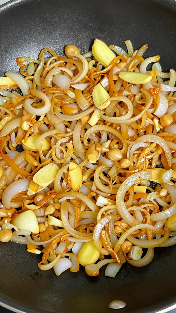 sautéed onions garlic ginger in skillet, golden aromatics