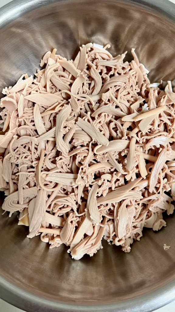 Finely chopped dark turkey meat in mixing bowl